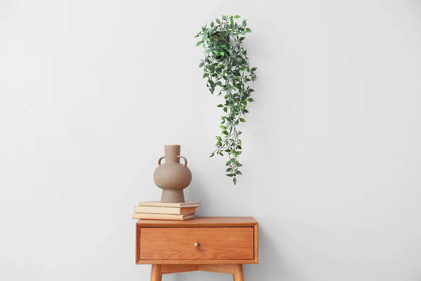 Vase Books Wooden Table Light Wall — ストック写真