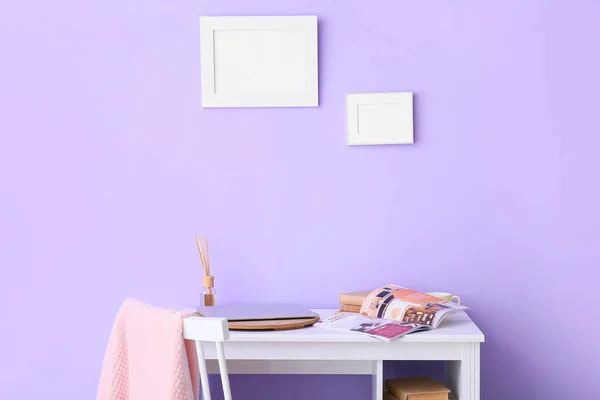 Workplace Laptop Magazine Blank Frames Lilac Wall — Φωτογραφία Αρχείου