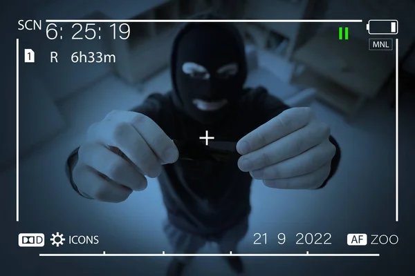 Thief Putting Sticky Tape Surveillance Camera — Stockfoto
