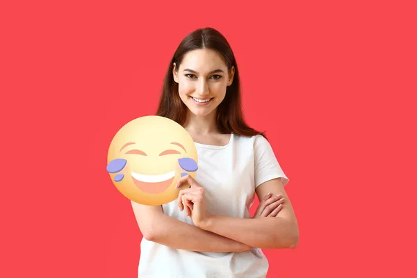 Pretty Young Woman Holding Emoticon Tears Joy Red Background — Stock Photo, Image