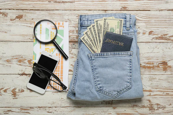 Jeans Passport Money Mobile Phone Eyeglasses Magnifier Map Light Wooden — Stock Photo, Image