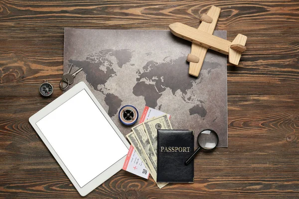 Guide Belongings World Map Tablet Computer Wooden Background — Stock Photo, Image