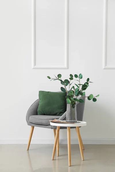 Table Eucalyptus Vase Magazine Armchair Light Wall — Stock Photo, Image