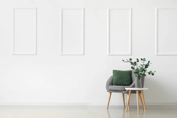 Table Eucalyptus Vase Magazine Armchair Light Wall — Stock Photo, Image