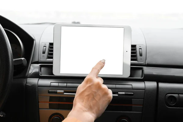 Female driver using tablet computer for navigation