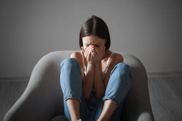 Crying Young Woman Sitting Armchair Home Violence Concept — Stock Photo, Image