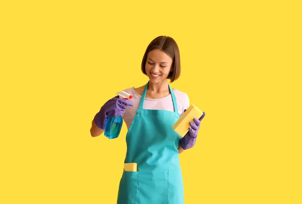 Young Woman Cleaning Sponge Bottle Detergent Yellow Background — Stock Photo, Image