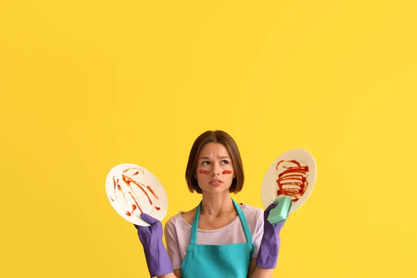 Upset Young Woman Cleaning Sponge Dirty Dishes Yellow Background — Stock Photo, Image