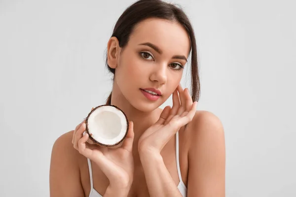 Young Woman Coconut Light Background — Stock Photo, Image