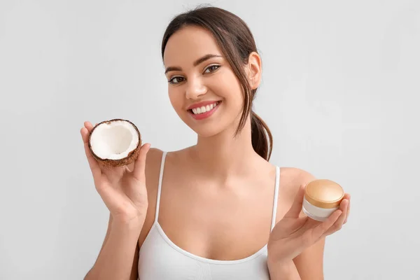 Young Woman Coconut Jar Cream Light Background — Stock Photo, Image
