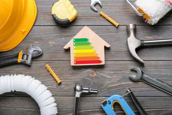 Model House Builder Supplies Energy Efficiency Rating Wooden Background — Stock Photo, Image