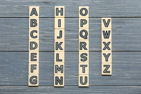 Different Letters Grey Wooden Background Alphabet Concept — Stock Photo, Image