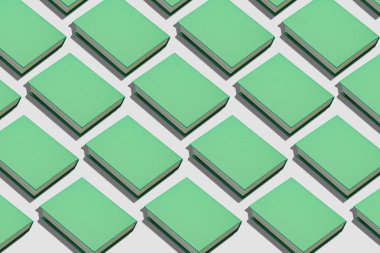 Açık arkaplan üzerine bir sürü yeşil kitap. Tasarım için desen