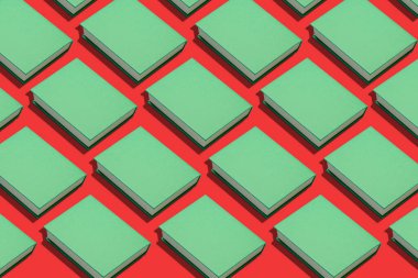 Kırmızı arka planda bir sürü yeşil kitap var. Tasarım için desen