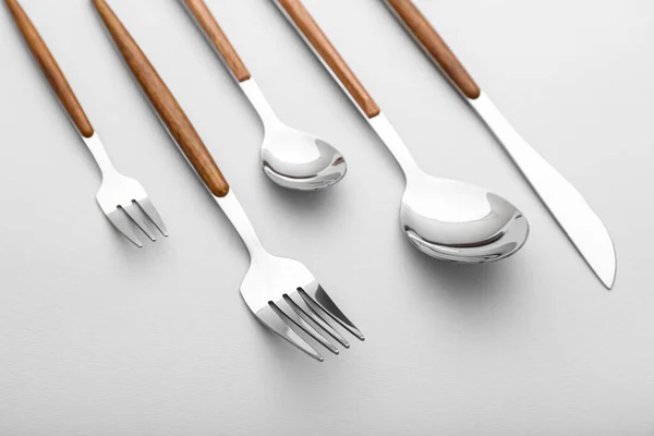 Set Stainless Steel Cutlery Wooden Handle Light Background Closeup — Stock Photo, Image