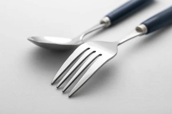 Stylish Stainless Steel Fork Spoon Light Background Closeup — Stock Photo, Image