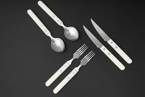 Set Stainless Steel Cutlery Plastic Handle Black Background — Stock Photo, Image