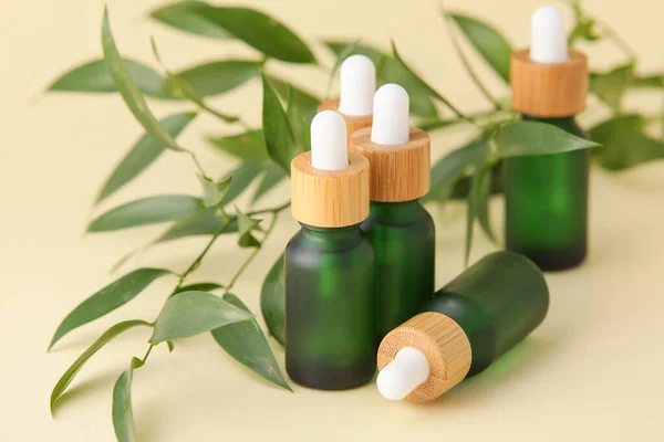 Bottles Natural Serum Plant Leaves Yellow Background — Stock Photo, Image
