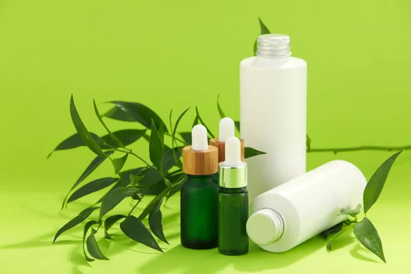 Bottles Natural Serum Cosmetics Plant Leaves Green Background — Stock Photo, Image