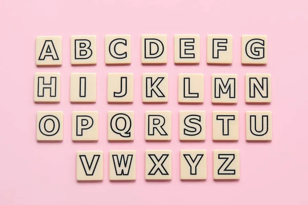 Verschiedene Buchstaben Auf Rosa Hintergrund Alphabet Konzept — Stockfoto