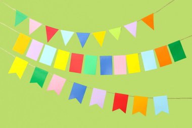 Colorful flags for Festa Junina on green background clipart