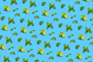 Mavi arka planda bir sürü nane yaprağı ve limon var. Tasarım için desen