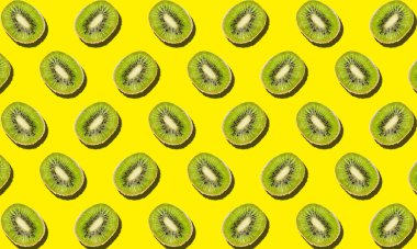 Birçok kişi sarı arka planda kivi kesti. Tasarım için desen