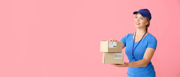 Female Courier Holding Parcels Pink Background Space Text — Stock Photo, Image