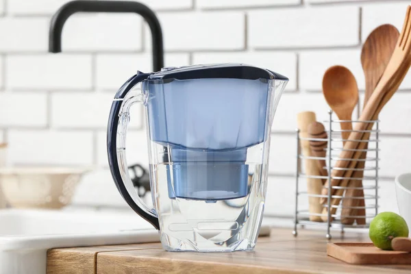 Water filter jug on counter in kitchen, closeup