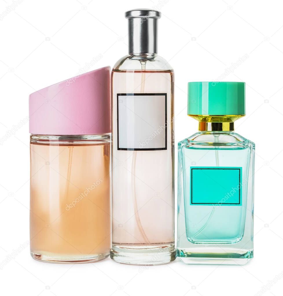 Bottles of aromatic perfume on white background