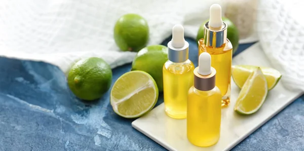 Bottles Lime Essential Oil Table — Stock Photo, Image