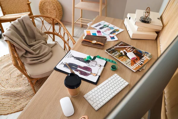 Workplace of clothes stylist in modern studio