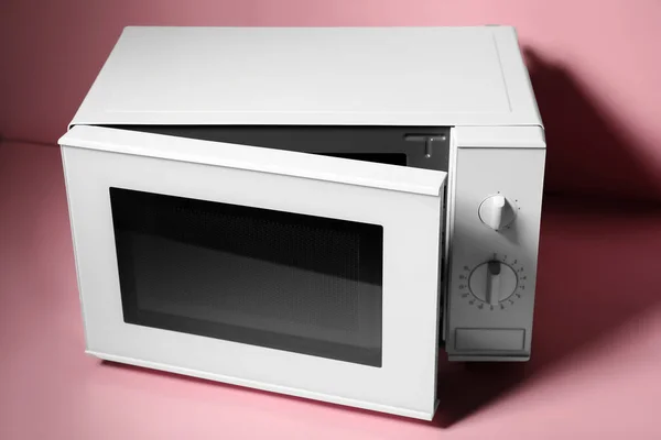 New Modern Microwave Oven Pink Background — Stock Photo, Image