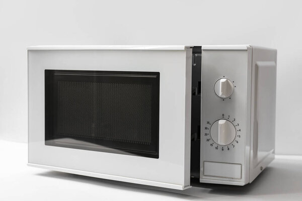 New modern microwave oven on light background