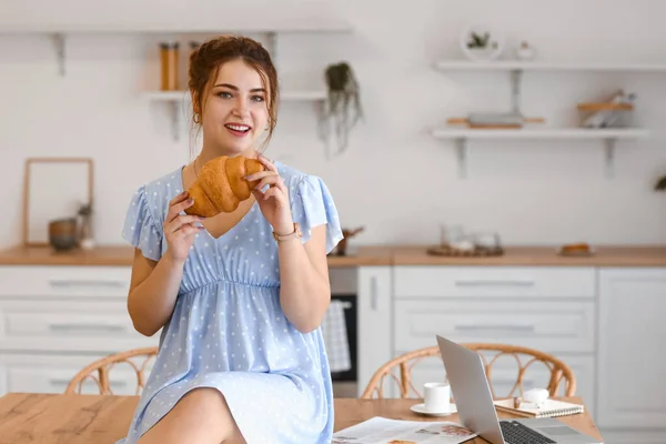 Beautiful Young Woman Eating Croissant Kitchen — Stock Photo, Image