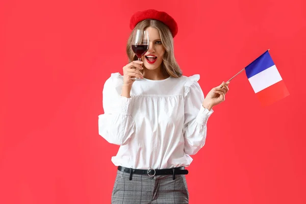 Hermosa Joven Con Bandera Francia Vino Sobre Fondo Rojo —  Fotos de Stock