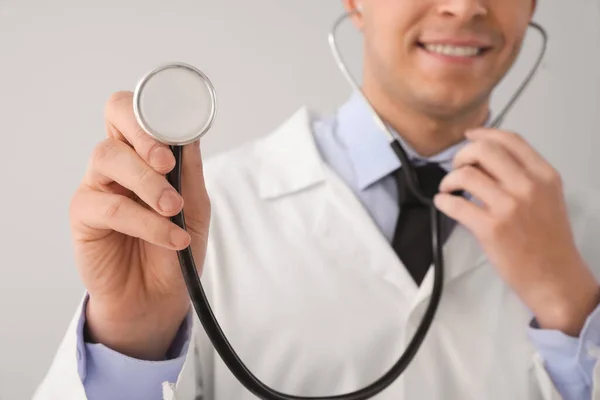 Young Male Doctor Stethoscope Grey Background Closeup — Stock Photo, Image