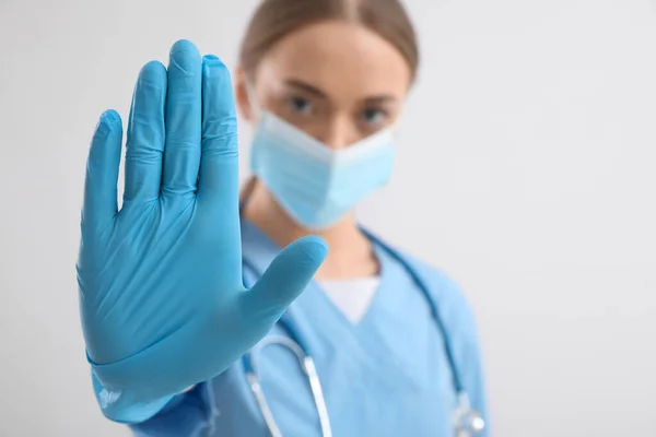 Female Nurse Showing Stop Gesture Light Background — Stock Photo, Image