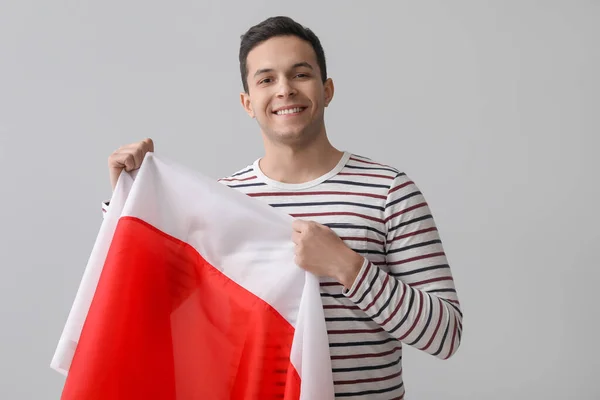 Knappe Jongeman Met Vlag Van Polen Lichte Achtergrond — Stockfoto