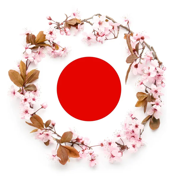 Rahmen Aus Schönen Blühenden Zweigen Auf Der Flagge Japans — Stockfoto