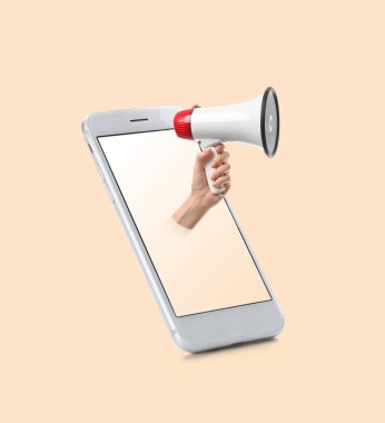 Cep telefonu ve el telefonu ve arka planda megafonla