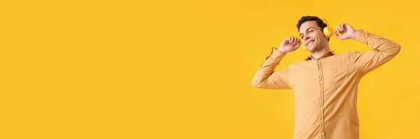 Handsome Young Man Listening Music Yellow Background Space Text — Stock Photo, Image