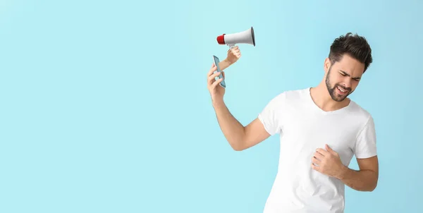 Stressed Young Man Mobile Phone Hand Holding Megaphone Blue Background — Stock Photo, Image