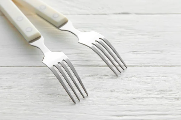 Stylish Stainless Steel Forks White Wooden Background Closeup — Stock Photo, Image