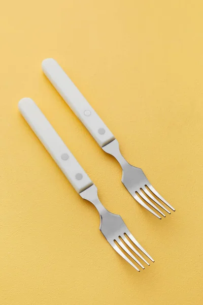 Stylish Stainless Steel Forks Yellow Background — Stock Photo, Image