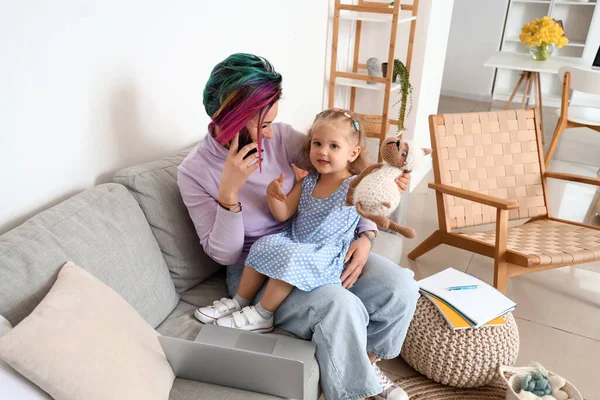 Little Girl Toy Her Mother Talking Mobile Phone Sofa Home — Stock Photo, Image