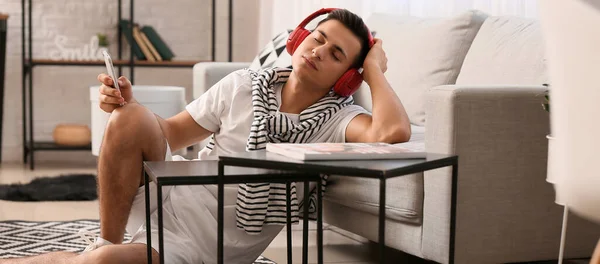 Sleepy Young Man Listening Music Home — Stock Photo, Image