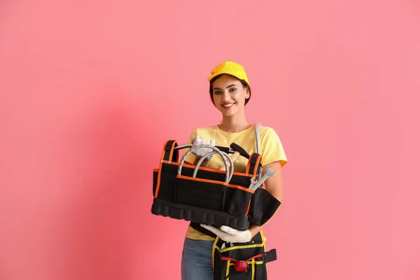 Female Plumber Holding Bag Tools Pink Background — Stock Photo, Image