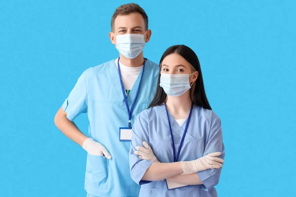 Medical Assistants Protective Masks Blue Background — Stock Photo, Image