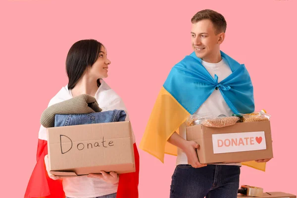 Volunteers Flags Ukraine Poland Donations Pink Background — Stock Photo, Image